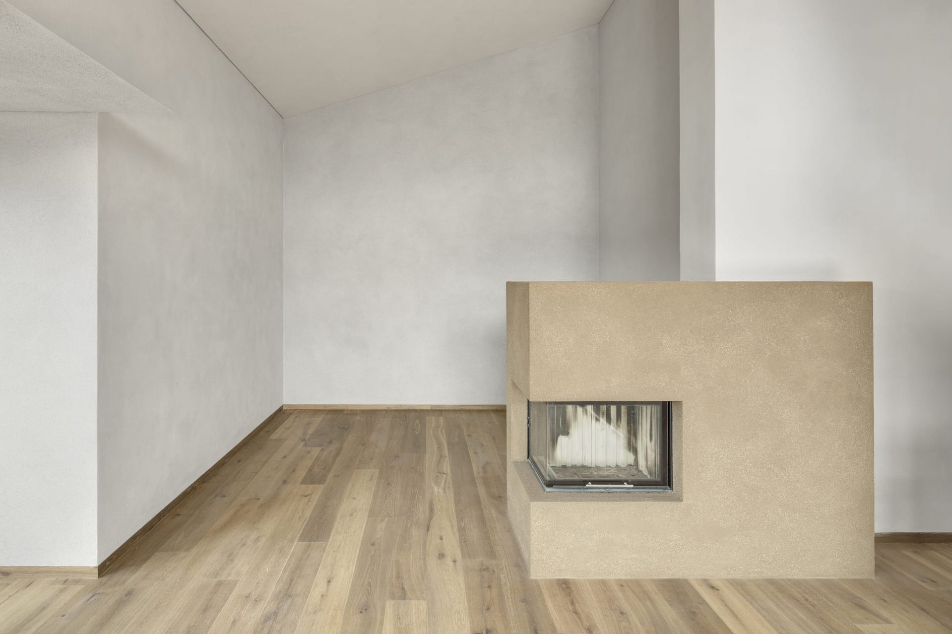 Matteo Brioni's coarse-grained clay plaster MultiTerra Smooth Cacao and Panna colors installed on walls, ceilings and furnitures in a private house in Brunico by Pedevilla Architects