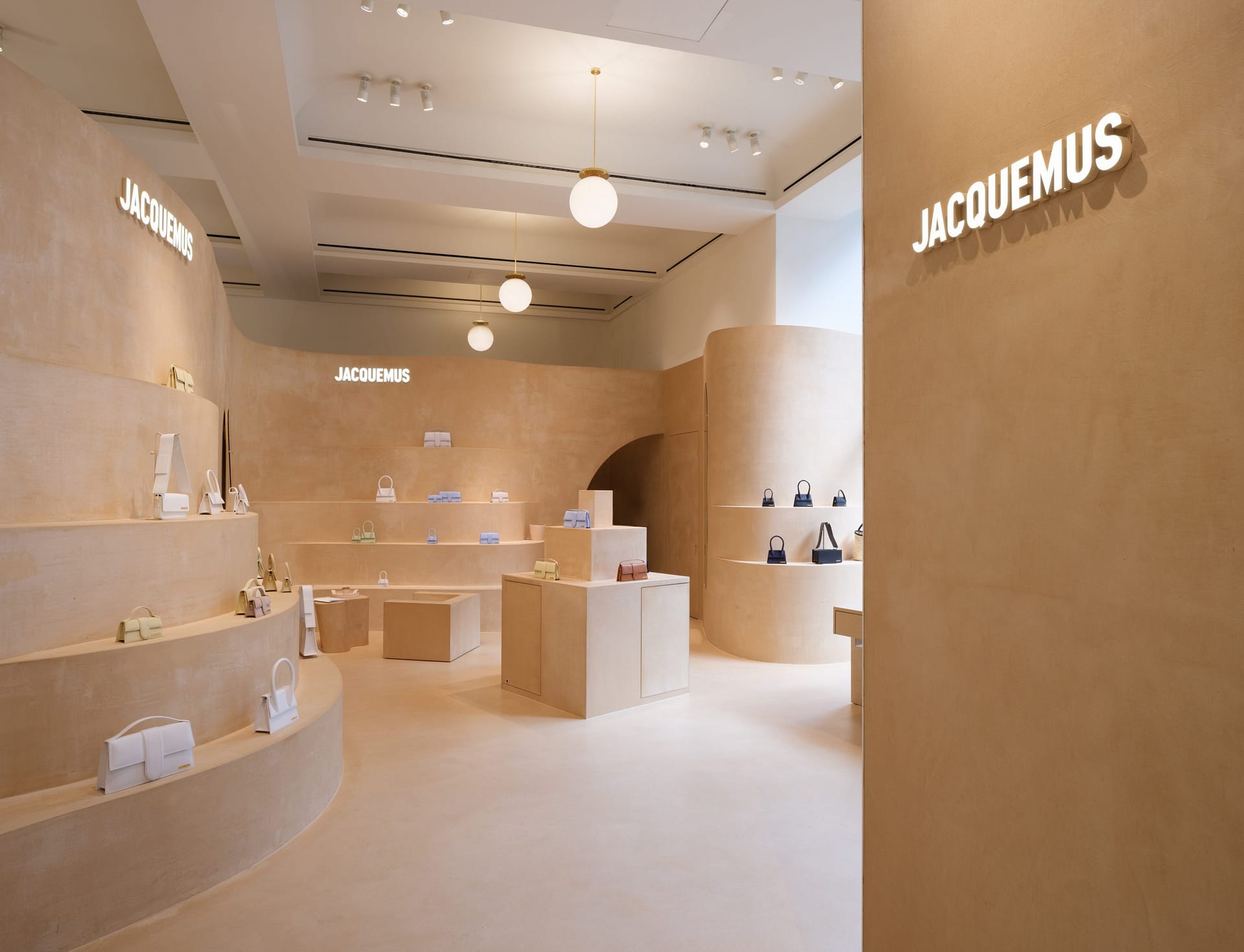 Fine-grained mixtures of clays and mineral binders TerraTon Floor and TerraTon Plus Wall both Smooth and with the same bespoke color applied to floor, walls and shelves of Jaquemus boutique into the London Selfridges. Project by AMO-OMA. Photo by Lewis Ronald