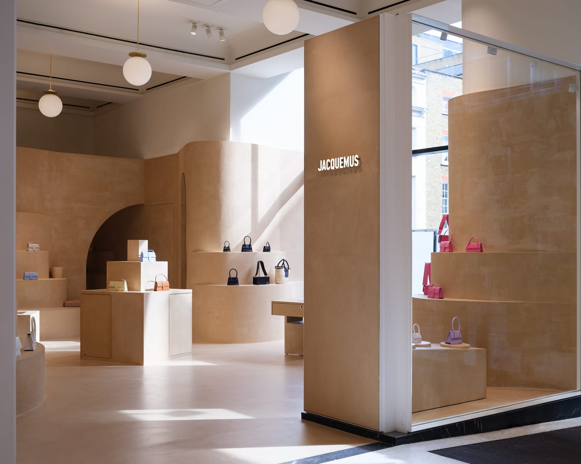 Fine-grained mixtures of clays and mineral binders TerraTon Floor and TerraTon Plus Wall both Smooth and with the same bespoke color applied to floor, walls and shelves of Jaquemus boutique into the London Selfridges. Project by AMO-OMA. Photo by Lewis Ronald