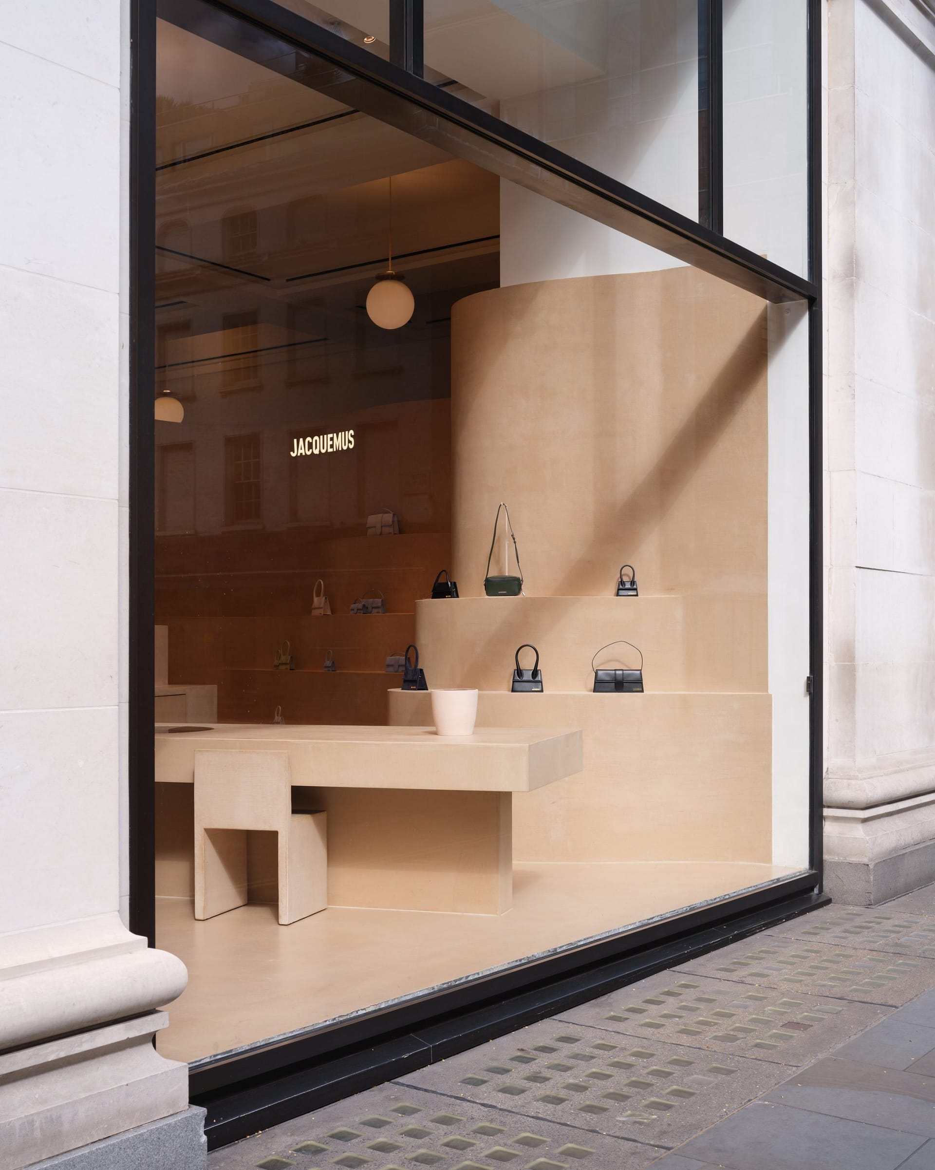 Fine-grained mixtures of clays and mineral binders TerraTon Floor and TerraTon Plus Wall both Smooth and with the same bespoke color applied to floor, walls and shelves of Jaquemus boutique into the London Selfridges. Project by AMO-OMA. Photo by Lewis Ronald